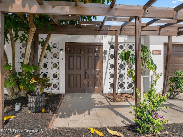 107 Algonquin Ter, Indian Harbour Beach, FL 32937 - doorway to property with a pergola and a gate