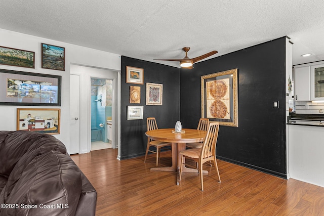 107 Algonquin Ter, Indian Harbour Beach, FL 32937 - dining space with a textured ceiling, wood finished floors, and ceiling fan
