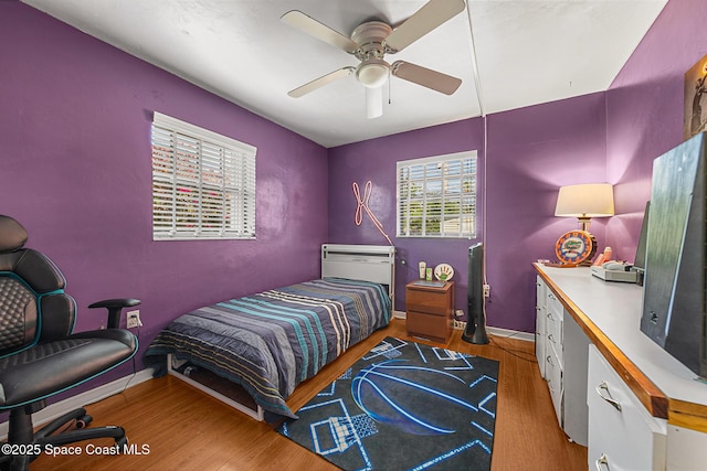 107 Algonquin Ter, Indian Harbour Beach, FL 32937 - bedroom with wood finished floors and a ceiling fan