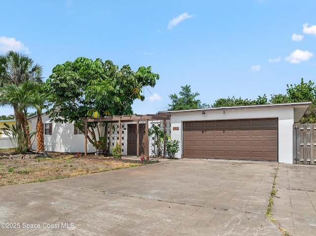 107 Algonquin Ter, Indian Harbour Beach, FL 32937 - view of front of home featuring stucco siding, concrete driveway, and an attached garage