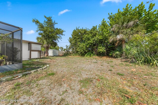 107 Algonquin Ter, Indian Harbour Beach, FL 32937 - view of yard with glass enclosure