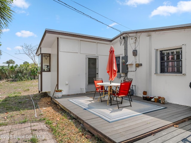 107 Algonquin Ter, Indian Harbour Beach, FL 32937 - wooden deck with outdoor dining space