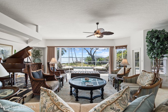 1495 Newfound Harbor Dr, Merritt Island, FL 32952 - living room with a textured ceiling, ceiling fan, and a healthy amount of sunlight