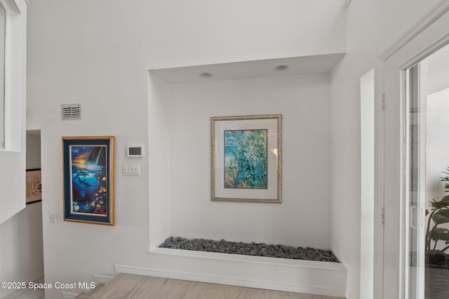 1495 Newfound Harbor Dr, Merritt Island, FL 32952 - staircase with baseboards, wood finished floors, and visible vents