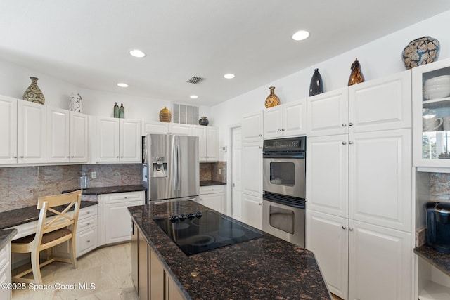 1495 Newfound Harbor Dr, Merritt Island, FL 32952 - kitchen with white cabinets, appliances with stainless steel finishes, recessed lighting, decorative backsplash, and visible vents