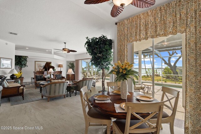 1495 Newfound Harbor Dr, Merritt Island, FL 32952 - dining area with a ceiling fan and visible vents