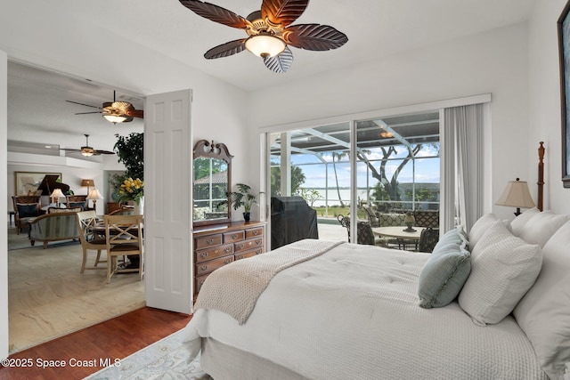 1495 Newfound Harbor Dr, Merritt Island, FL 32952 - bedroom with ceiling fan, a sunroom, access to outside, and wood finished floors