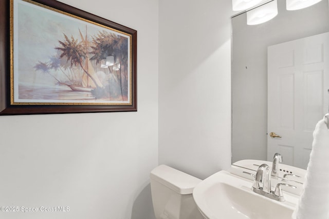 1495 Newfound Harbor Dr, Merritt Island, FL 32952 - half bathroom with a sink and toilet