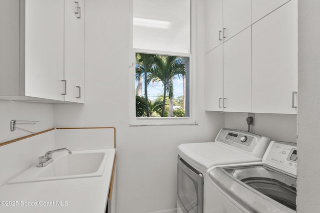 1495 Newfound Harbor Dr, Merritt Island, FL 32952 - laundry room featuring a sink, baseboards, washing machine and dryer, and cabinet space