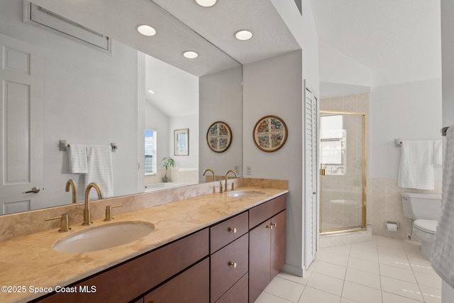 1495 Newfound Harbor Dr, Merritt Island, FL 32952 - bathroom featuring a sink, tile patterned floors, a stall shower, and toilet