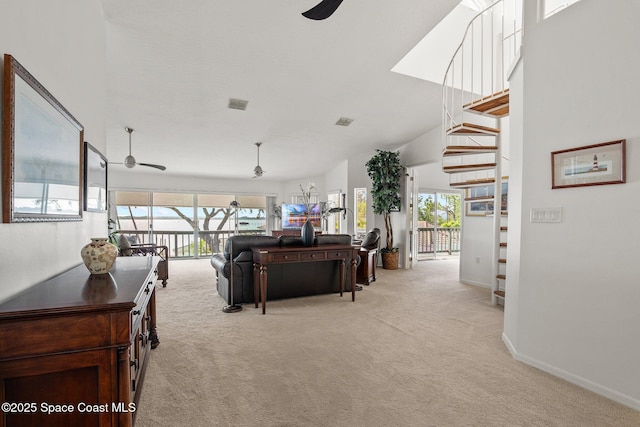 1495 Newfound Harbor Dr, Merritt Island, FL 32952 - living room with a ceiling fan, baseboards, light colored carpet, and visible vents