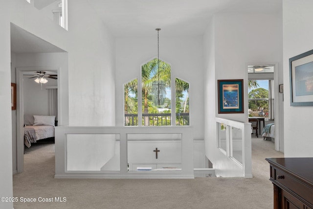 1495 Newfound Harbor Dr, Merritt Island, FL 32952 - interior space with ceiling fan, a healthy amount of sunlight, carpet, and a towering ceiling