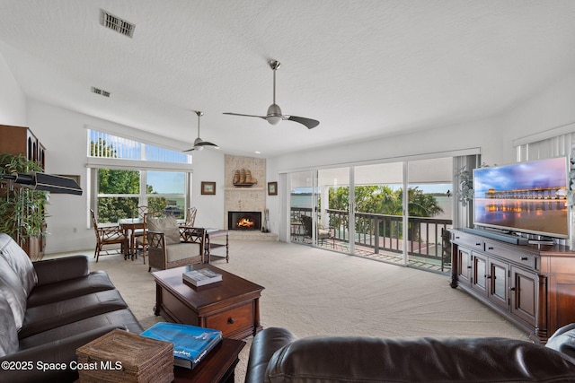 1495 Newfound Harbor Dr, Merritt Island, FL 32952 - living area featuring visible vents, a ceiling fan, a healthy amount of sunlight, and light carpet