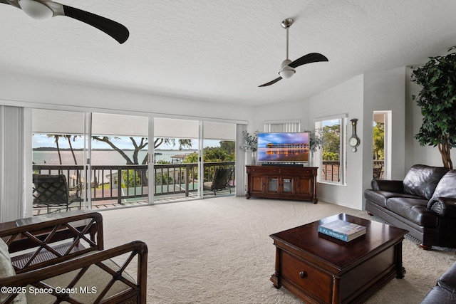 1495 Newfound Harbor Dr, Merritt Island, FL 32952 - carpeted living room with a ceiling fan and a textured ceiling