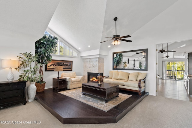 1495 Newfound Harbor Dr, Merritt Island, FL 32952 - carpeted living room with ceiling fan, a wealth of natural light, and a fireplace
