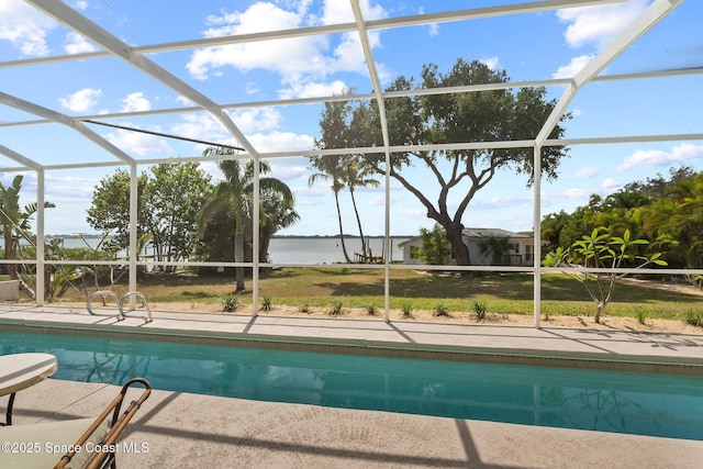 1495 Newfound Harbor Dr, Merritt Island, FL 32952 - outdoor pool with glass enclosure, a water view, a patio area, and a lawn