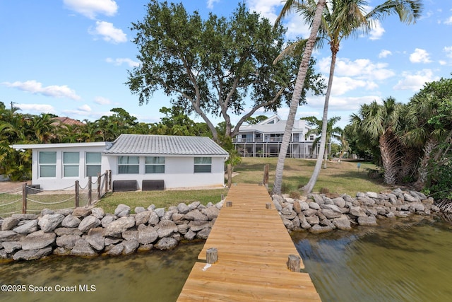 1495 Newfound Harbor Dr, Merritt Island, FL 32952 - view of dock featuring a lawn, a water view, and fence