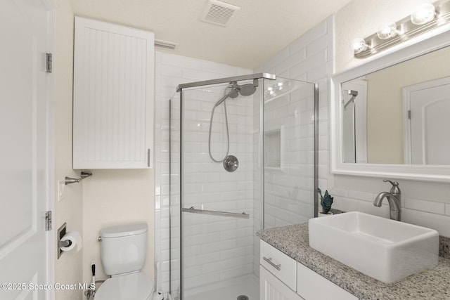 1495 Newfound Harbor Dr, Merritt Island, FL 32952 - bathroom featuring vanity, a shower stall, toilet, and visible vents