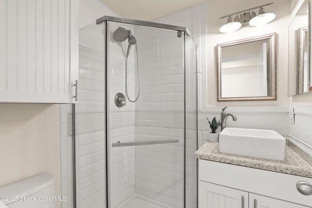 1495 Newfound Harbor Dr, Merritt Island, FL 32952 - bathroom with vanity, toilet, wainscoting, and a stall shower