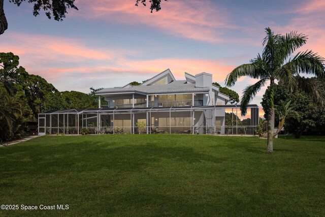 1495 Newfound Harbor Dr, Merritt Island, FL 32952 - back of property with a lawn, a lanai, a balcony, and a chimney