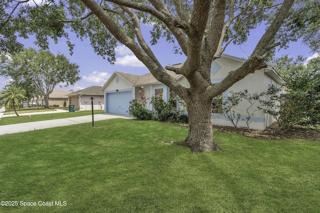 view of front facade featuring concrete driveway, a garage, a front lawn, and stucco siding