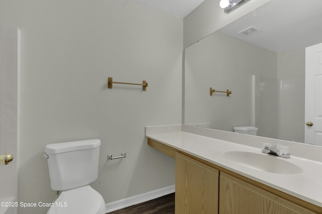 full bath with toilet, a shower, and visible vents