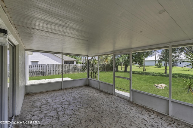 unfurnished sunroom featuring a healthy amount of sunlight