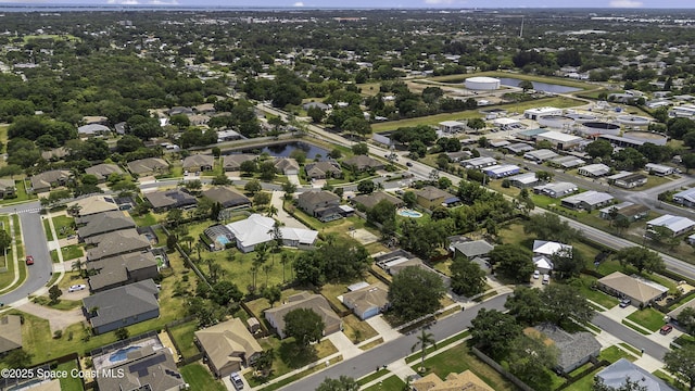 bird's eye view featuring a water view and a residential view