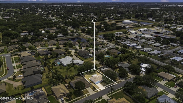 bird's eye view with a water view and a residential view