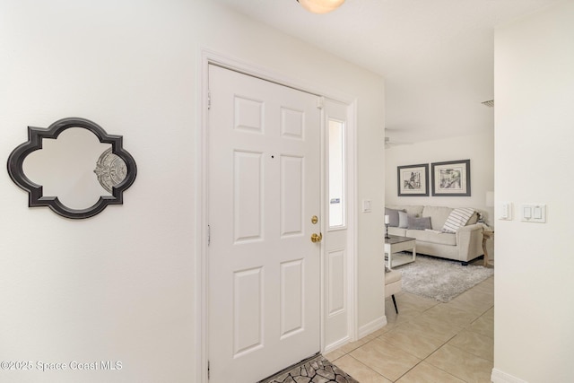 53 Piney Branch Way Unit D, West Melbourne, FL 32904 - foyer with baseboards and light tile patterned floors
