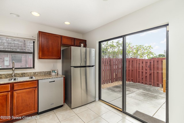 53 Piney Branch Way Unit D, West Melbourne, FL 32904 - kitchen with recessed lighting, a sink, appliances with stainless steel finishes, and light tile patterned flooring