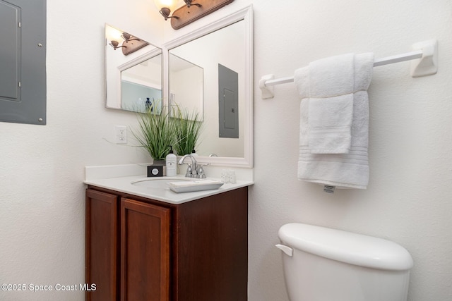 53 Piney Branch Way Unit D, West Melbourne, FL 32904 - bathroom with vanity, electric panel, and toilet