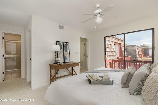 53 Piney Branch Way Unit D, West Melbourne, FL 32904 - bedroom featuring visible vents, baseboards, access to outside, and light carpet