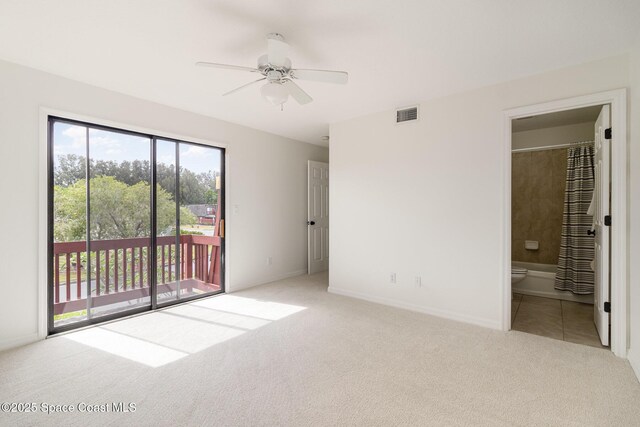 53 Piney Branch Way Unit D, West Melbourne, FL 32904 - interior space featuring access to exterior, carpet, baseboards, ensuite bathroom, and visible vents