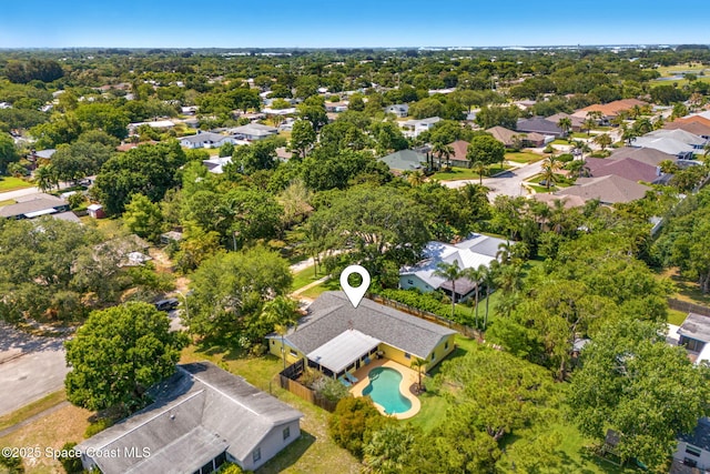 aerial perspective of suburban area with a pool area