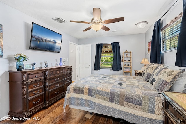 bedroom featuring wood finished floors and a ceiling fan