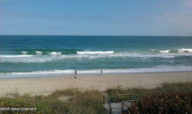 view of water feature with a beach view