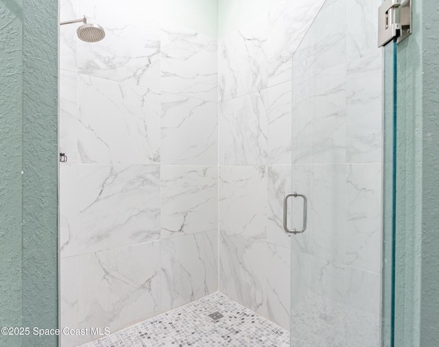 bathroom with a stall shower