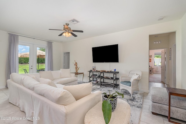 10033 W Verona Cir, Vero Beach, FL 32966 - living area featuring visible vents, plenty of natural light, and light tile patterned floors
