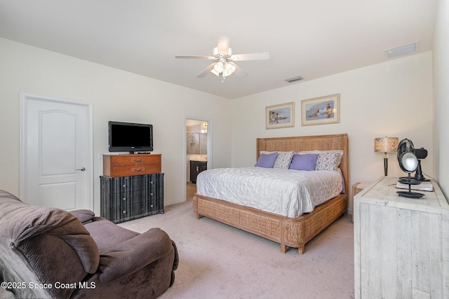 10033 W Verona Cir, Vero Beach, FL 32966 - bedroom with carpet floors, ceiling fan, ensuite bath, and visible vents