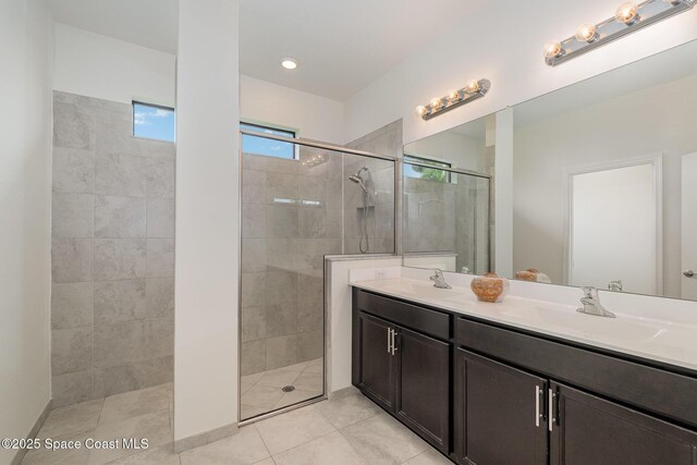 10033 W Verona Cir, Vero Beach, FL 32966 - bathroom featuring double vanity, a tile shower, and a sink