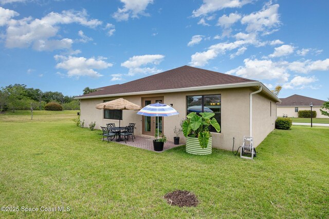 10033 W Verona Cir, Vero Beach, FL 32966 - rear view of house featuring a lawn, a patio, and stucco siding