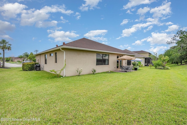 10033 W Verona Cir, Vero Beach, FL 32966 - back of house featuring a lawn, a patio area, and stucco siding