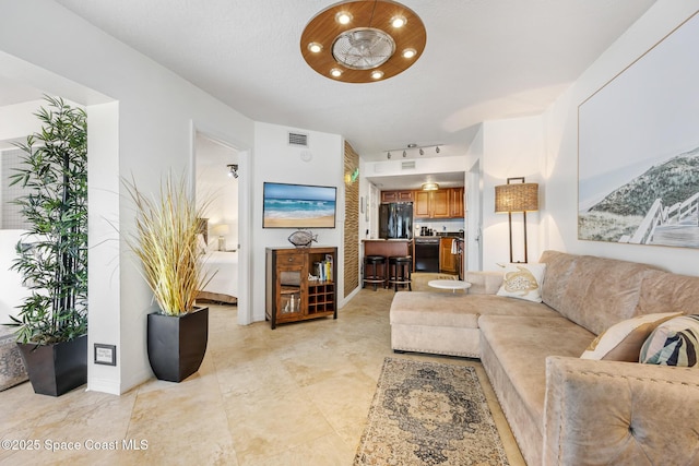 8600 Ridgewood Ave Unit 1208, Cape Canaveral, FL 32920 - living area featuring baseboards and visible vents