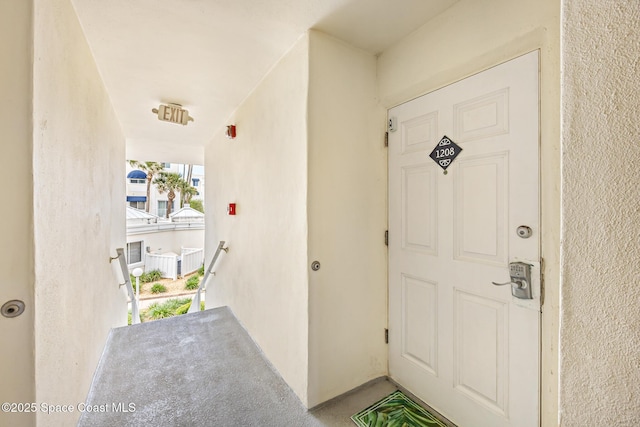 8600 Ridgewood Ave Unit 1208, Cape Canaveral, FL 32920 - doorway to property with stucco siding
