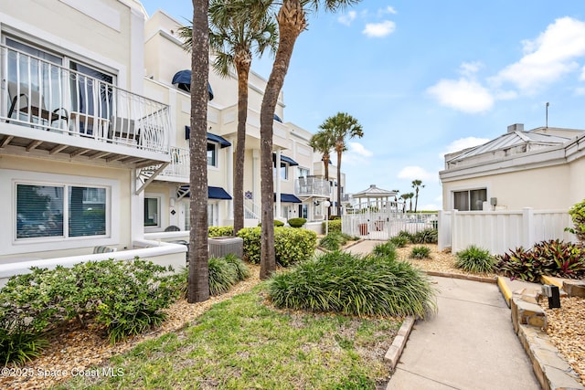 8600 Ridgewood Ave Unit 1208, Cape Canaveral, FL 32920 - surrounding community featuring a residential view and fence