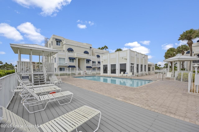 8600 Ridgewood Ave Unit 1208, Cape Canaveral, FL 32920 - community pool featuring a gazebo, a patio area, fence, and a deck