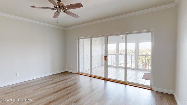 905 N Harbor City Blvd Unit 404, Melbourne, FL 32935 - spare room with light wood-style floors, crown molding, baseboards, and a ceiling fan