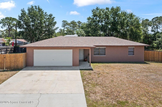 single story home with a front yard, a garage, fence, concrete driveway, and stucco siding