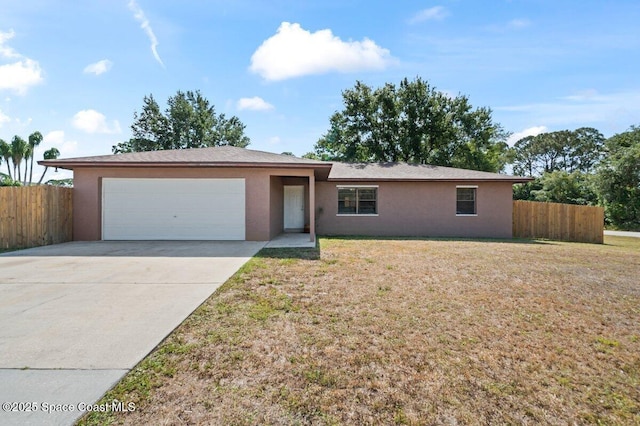 single story home with an attached garage, fence, driveway, and stucco siding